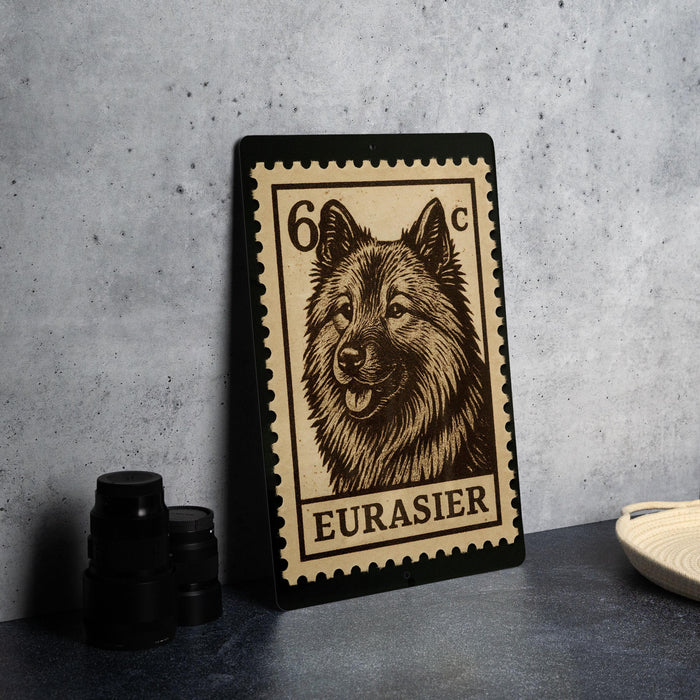 A metal stamp featuring a close-up of a dog's face, with the text "EURASIER" printed on it.