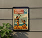 A vintage-style poster of two women playing beach volleyball, with a beach volleyball depicted in the center of the poster.