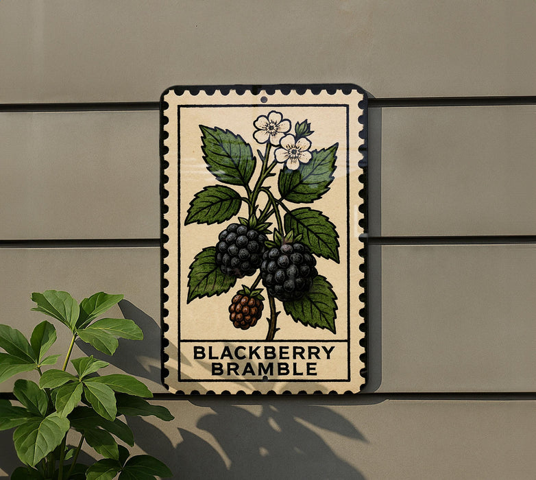 A metal sign with a blackberry bramble illustration is mounted on a wall, with a plant to the left.