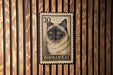A metal stamp featuring a close-up of a Birman cat's face, with the text "BIRMAN CAT" printed below it.