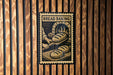 A sign that reads "BREAD BAKING" is displayed on a wooden wall, featuring an illustration of a baker working with dough.
