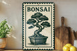 A framed bonsai tree illustration is displayed on a shelf, accompanied by a wooden cutting board and a potted plant.