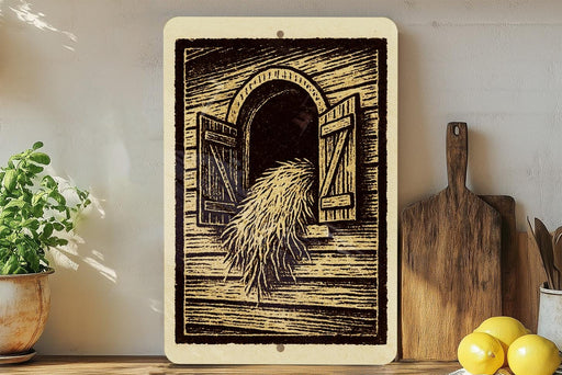 a wooden sign with an illustration of a hay bale, placed on a shelf next to a wooden cutting board and a potted plant.