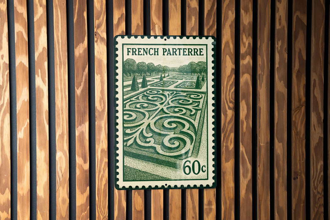 A French postage stamp with a garden design on it, displayed on a wooden wall.
