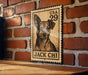 A wooden sign with a dog illustration and the text "USA 29 JACK CHI" is displayed on a brick wall.