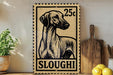 A 25c postage stamp featuring a dog's head, with the word "SLOUGHI" below it, is displayed on a shelf next to a wooden cutting board and some lemons.
