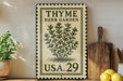 A vintage-style metal sign with a thyme herb garden design, featuring a plant illustration and the text "THYME HERB GARDEN USA.29". The sign is displayed on a shelf next to a wooden cutting board and a potted plant.