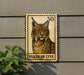 A postage stamp featuring an illustration of a European lynx, a wild cat native to Europe and Asia, is displayed on a wall.