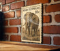 a wooden table with a framed Asian elephant stamp on the wall.
