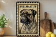 A framed illustration of a bull mastiff dog is displayed on a shelf, accompanied by a wooden cutting board and a potted plant.