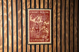 A U.S. postage stamp depicting a cherry picking scene, with a person picking cherries from a tree.