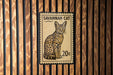 A postage stamp featuring a Savannah cat, with the text "SAVANNAH CAT" and the denomination "20c".
