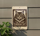 A sign featuring a close-up of a cat's face, with the text "SIBERIAN CAT" below it.