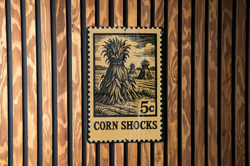 A 5 cent stamp depicting a corn shock, which is a type of natural disaster.
