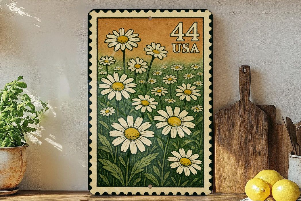 a framed print of a field of white daisies with a green border, placed on a shelf next to a wooden cutting board and some lemons.