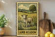 A framed illustration of a lamb standing in a grassy field with flowers, accompanied by the text "LAMB MEADOW" on the frame.