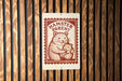 A sign with the text "HAMMSTER PARENT" and an illustration of a hamster holding a baby hamster.