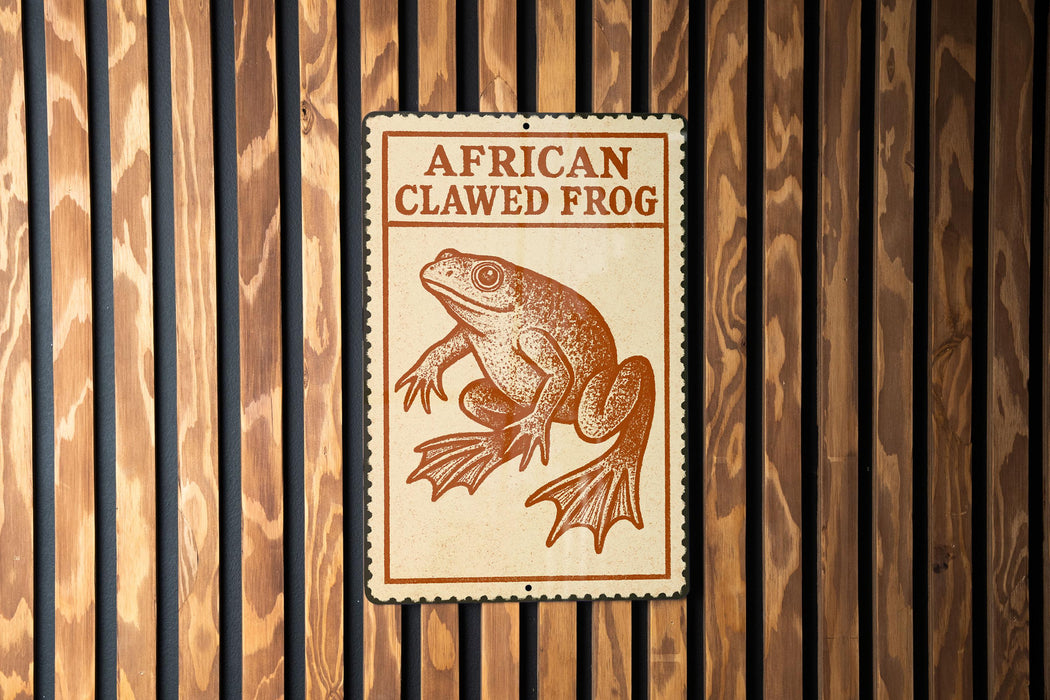 a sign with an illustration of an African clawed frog.