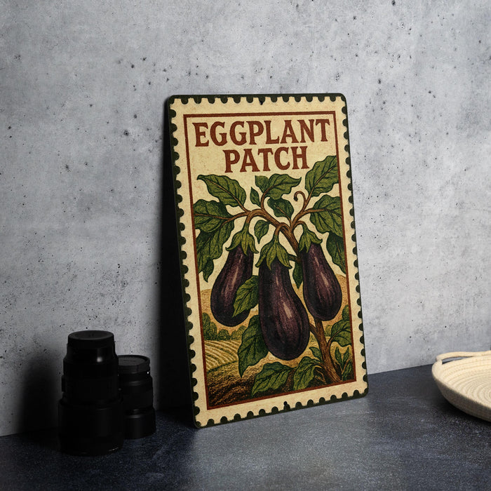 a decorative sign with the text "Eggplant Patch" and an illustration of eggplants on a tree branch.