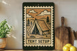 A framed illustration of a tent on a wall, with the text "TENT SETUP" below it, is displayed next to a wooden cutting board and a potted plant.