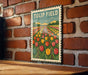 A vintage-style metal sign with a colorful illustration of a tulip field hangs on a brick wall.