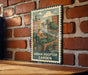 A vintage-style metal sign with an illustration of a person tending to a garden, mounted on a brick wall.