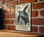 A 20c postage stamp featuring a sea turtle on a brick wall.