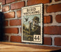 A vintage-style metal sign with the text "BIRD WATCHING" and an illustration of a person using binoculars to observe a bird.