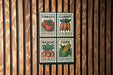 four postage stamps, each depicting a different vegetable: tomato, carrot, radish, and corn.
