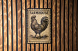 a rooster, which is a symbol often associated with farmhouses and rural settings.