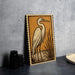 a large, detailed illustration of a heron standing on a rock, with a basket and other objects in the background.