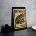 A framed poster of a frog is displayed on a wall, with a stamp-like border and the text "PET FROG FOREVER" printed on it.