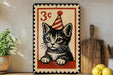 A vintage-style 3-cent stamp featuring a cat wearing a party hat, placed on a wooden surface next to a wooden cutting board and some lemons.