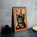 A metal frame with a printed illustration of a cat wearing a party hat, resembling a postage stamp design.