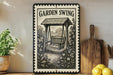 A vintage-style metal sign with the text "GARDEN SWING" and an illustration of a wooden swing set in a garden setting.