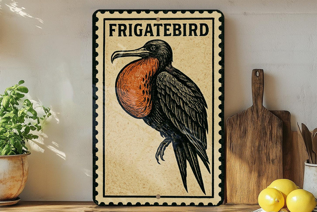 a framed illustration of a Frigatebird, a bird known for its distinctive appearance, perched on a wooden surface.