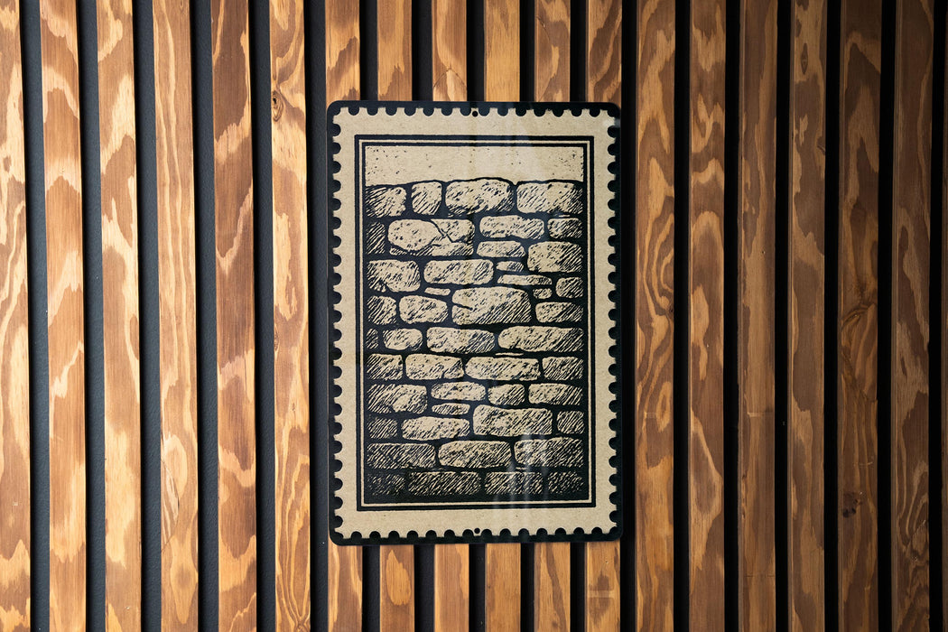 a brick wall with a black and white illustration of a brick wall on it.