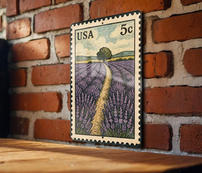 A framed illustration of a field of lavender flowers is mounted on a brick wall.