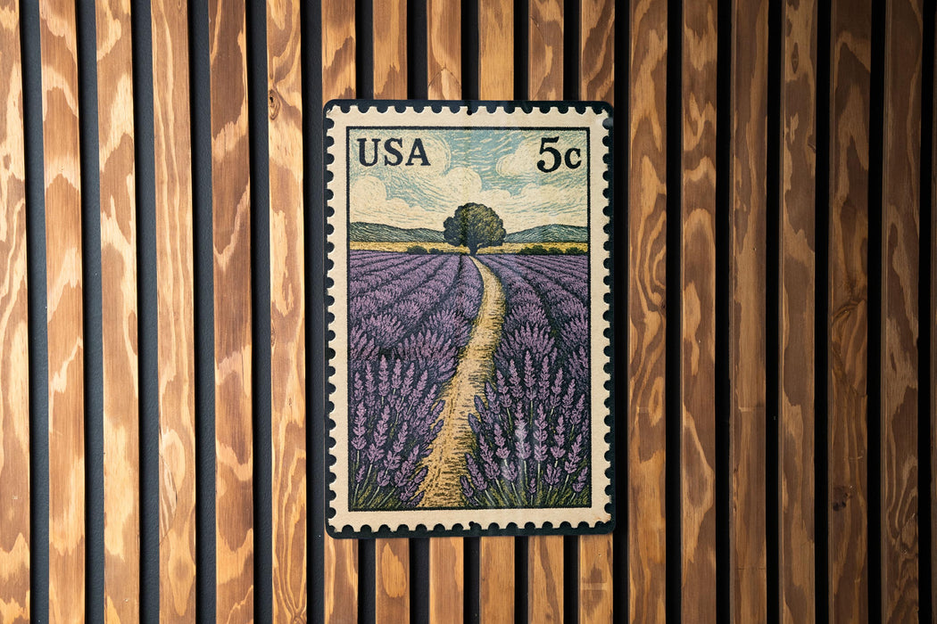 A U.S. postage stamp depicting a field of lavender flowers, with a path leading through the field.