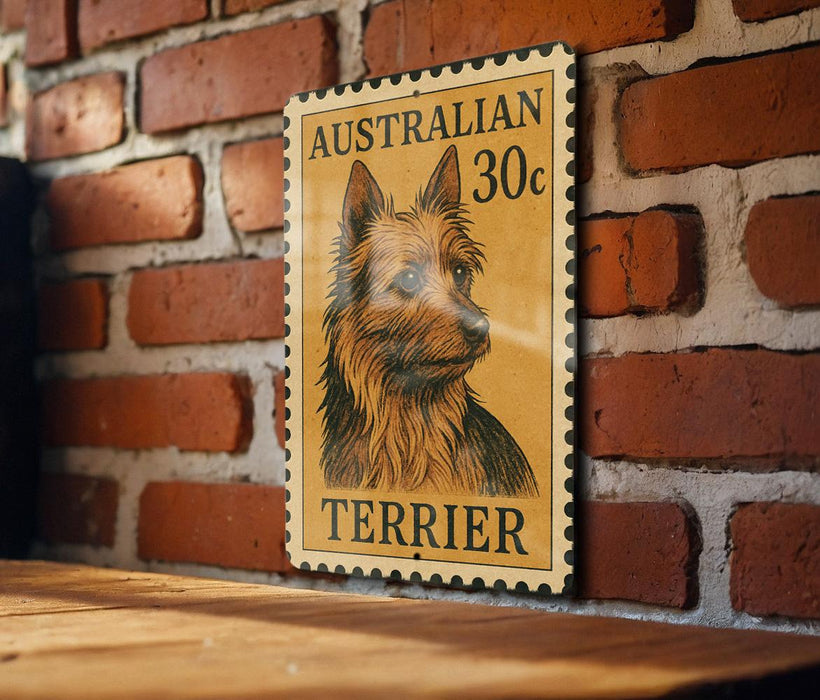 A wooden table with a vintage-style Australian terrier dog stamp displayed on it.