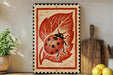 a decorative ladybug design on a wooden frame, placed on a shelf next to a wooden cutting board and a potted plant.