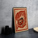 a wooden frame with a ladybug design on it, placed on a table next to some black camera lenses.