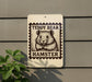 A sign featuring a teddy bear and the word "HAMSTER" printed on it.
