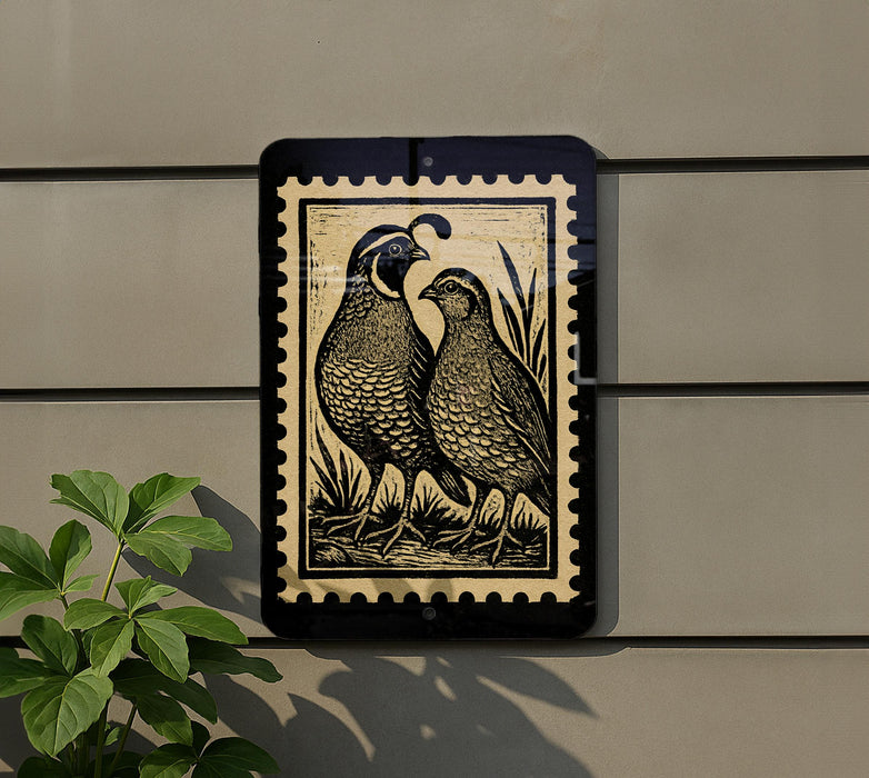 a black and white stamp-like artwork depicting two quails standing together on a wall.
