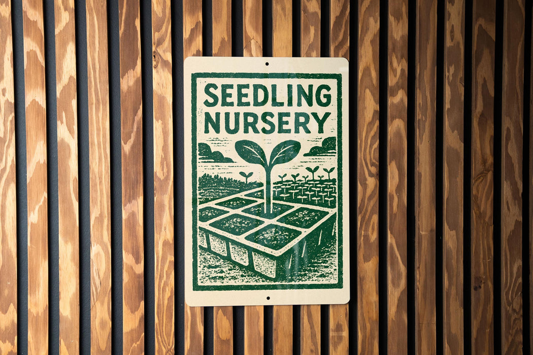 a sign for a seedling nursery, with a green and white design depicting a plant growing in a garden.