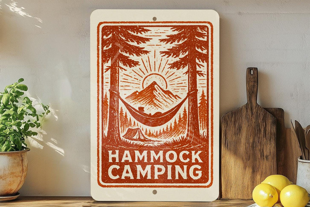a sign with a hammock and camping scene, surrounded by various kitchen utensils and a potted plant.