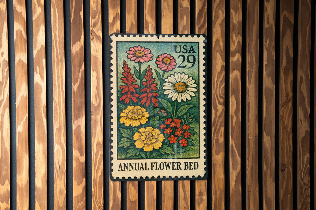 A vintage US postage stamp depicting a colorful floral arrangement, mounted on a wooden wall.