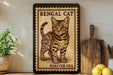 A framed image of a Bengal cat, with the text "BENGAL CAT" and "FREVER USA" printed on it, is displayed on a shelf next to a wooden cutting board and a potted plant.