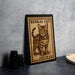 A framed image of a Bengal cat, with the text "BENGAL CAT" and "FREVER USA" printed on it, is displayed on a table.
