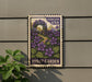 A vintage Forever USA postage stamp featuring a purple garden scene with purple flowers and green leaves, mounted on a gray wall.